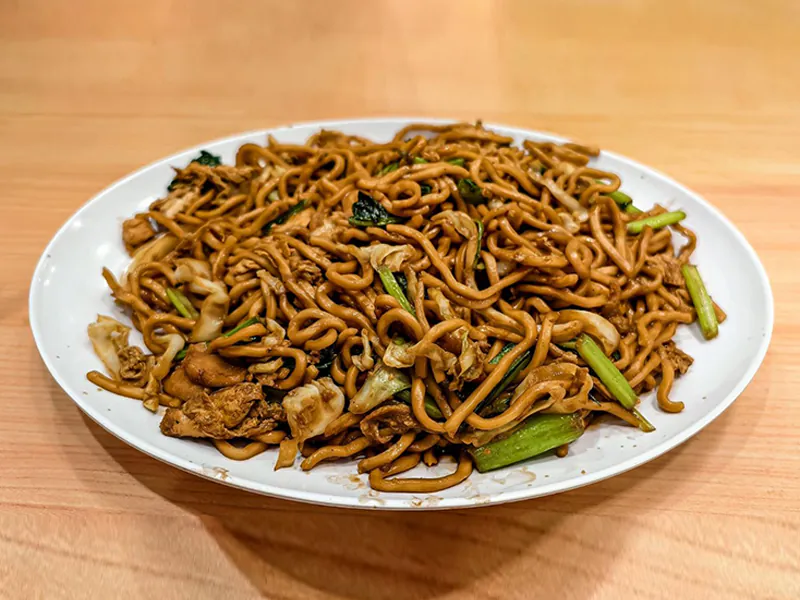 Savory noodles stir-fried with soy sauce and greens at New King Wok, a Chinese Restaurant in Bensalem